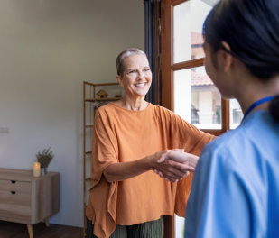 caregiver Stop by for a visit elderly patient woman in home